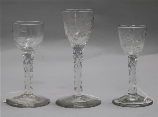 Three early 18th century facet stem rose engraved glasses